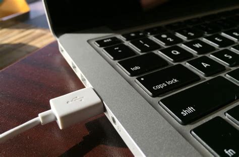 Plug the flip into the usb port. How to Transfer Photos from an iPhone to a Computer ...