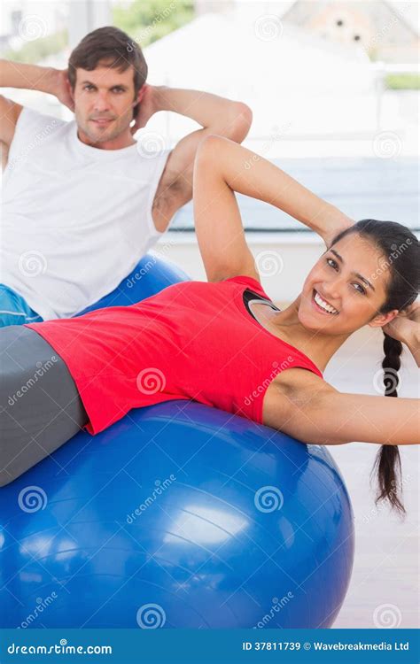 fit couple exercising on fitness balls in gym stock image image of high angle 37811739