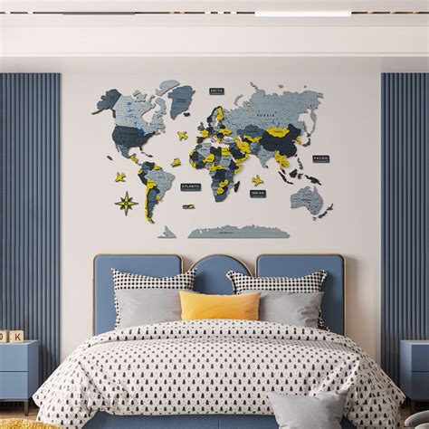 A Bed Room With A Large Map Of The World On The Wall Above Its Headboard