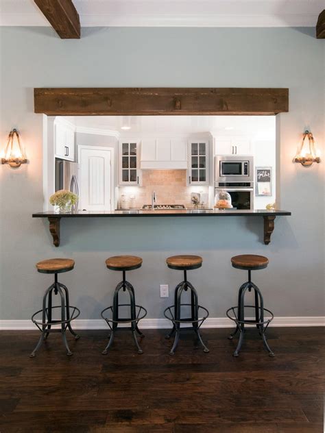 Black and white modern kitchen with wine rack. Photos | Kitchen window bar, Half wall kitchen, Living ...