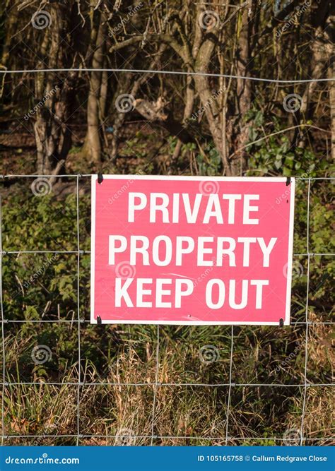 Close Up Of Red And White Country Sign Private Property Keep Out Stock