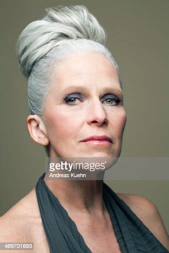 Mature Woman With Grey Haired Bun Portrait Photo Getty Images
