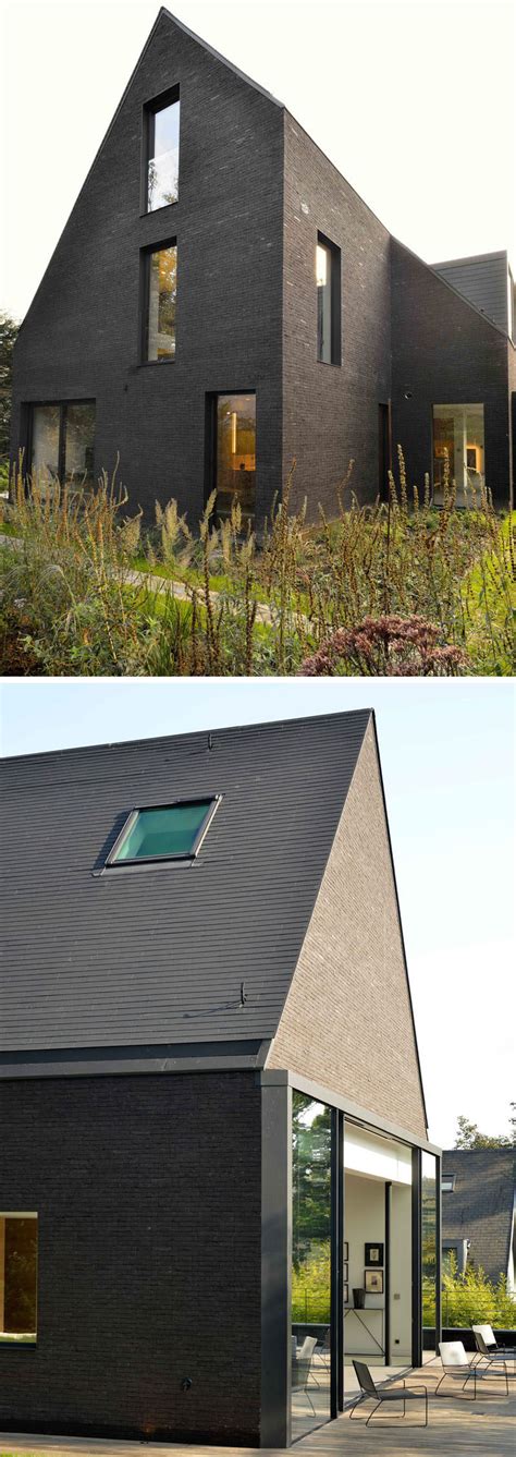 Private spaces and bedrooms are on lower floors, and the. This contemporary black brick house was renovated for a ...