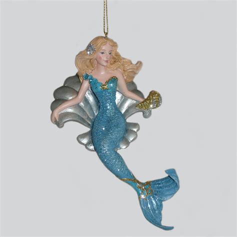You know how if you hold a shell up to your ear you can hear the ocean? Mermaid in Shell Ornament | The Music Box Company