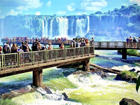 Many Visitors On Walkway Over One Of The Rivers In Iguazu Falls