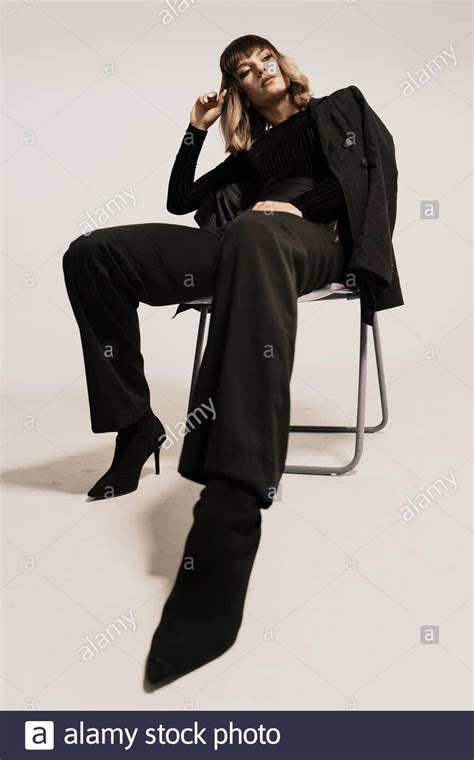Download This Stock Image Portrait Beautiful Woman With Attitude Sitting On A Chair We