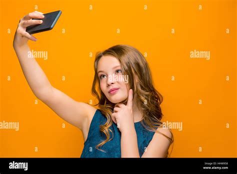 The Face Of Playful Happy Teen Girl With Phone Stock Photo Alamy