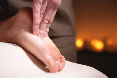 Closeup Reflexology Foot Massage Male Masseur Makes Foot Massage To A Female Client Foot Care