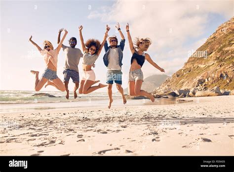 Group Of Friends Together On The Beach Having Fun Happy Young People