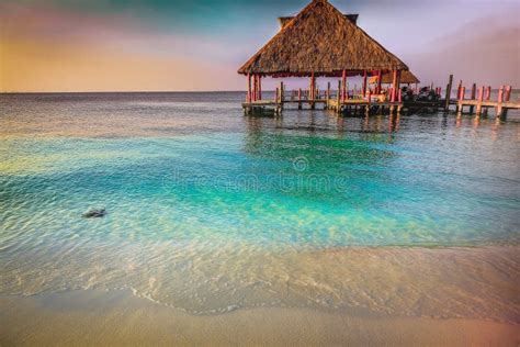 Tropical Paradise Sand Beach In Caribbean With Palapa And Pier Cancun