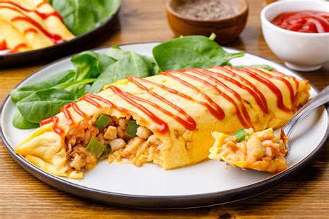 Omurice Is An Omelet Wrapped Around Fried Rice And Topped With Ketchup Its A Perfect Example