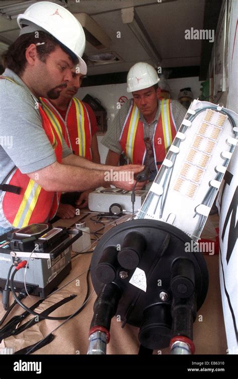 Workers Splice Fiber Optic Cables In A Mobile Fiber Optic Splicing