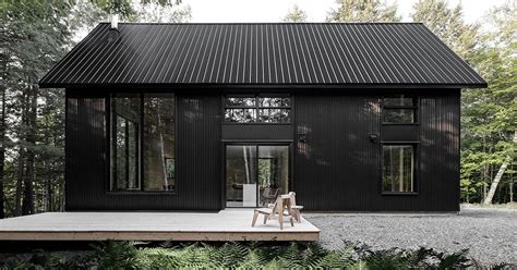 Two Steel Black Cabins Form Striking Quebec Chalet By