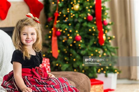 Adorable Girl Ready To Open Presents At A Christmas Party Photo Getty