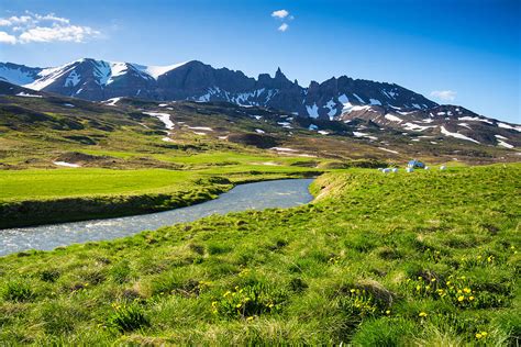 Landscape With Green Meadow River And Mountains In North Iceland