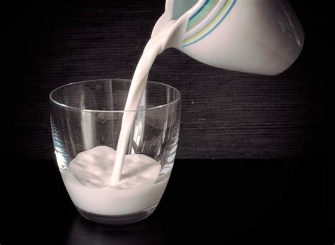Milk Is Poured Into A Glass Copyright Free Photo By M Vorel