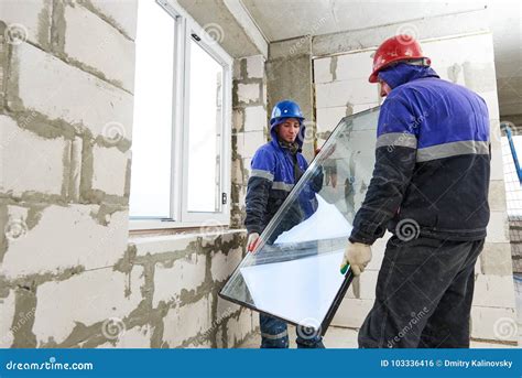 Windows Installation Two Construction Workers Installing Glass Stock