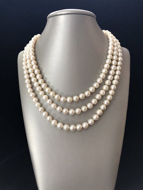 Triple Strand White Cultured Pearl Necklace With K Yellow Gold Ruby