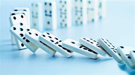 When Dominoes Fall How Fast The Row Topples Depends On Friction