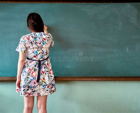 Female Teacher At An Elementary School In South Korea Posing To Write