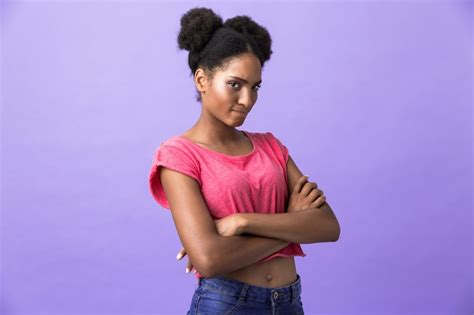 premium photo offended or naughty african american woman standing with arms folded isolated