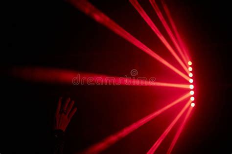 Bright Red Neon Laser Lights Illuminate The Darkness Creating Lines And