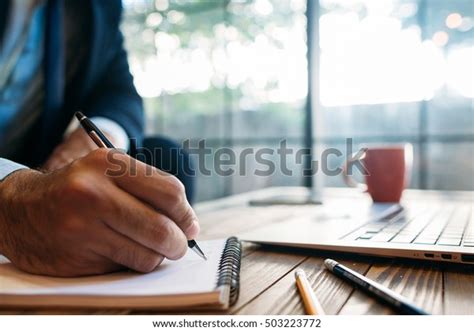 Male Hand Taking Notes On Notepad Stock Photo Edit Now 503223772