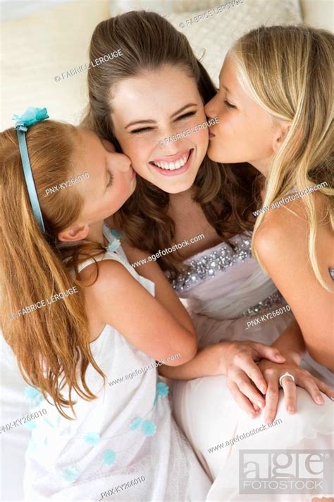 Two Girls Kissing A Bride Stock Photo Picture And Royalty Free Image