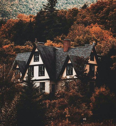 A Home Surrounded By Trees And Woodlands