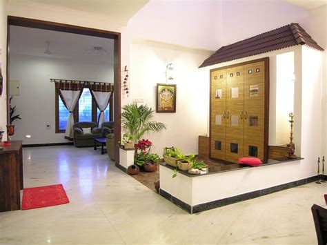 Trendy and practical open kitchen designs for indian homes. Slope roof and low height wall designed in the puja room ...