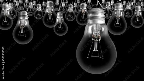 Shining Light Bulb With New Year 2023 And Group Of Dark Light Bulbs In