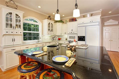 The tops of your cabinets offer prime real estate for storage. Decorating Ideas for the Space Above Kitchen Cabinets ...