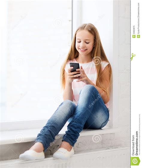 Girl With Smartphone At School Royalty Free Stock Photo
