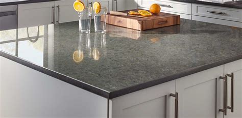 This transitional kitchen embraces bold color with a blue and gray island featuring carrick matte countertops. Kitchen Room Scene | Babylon Quartz Countertop page2