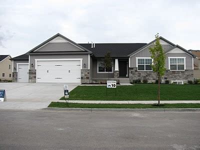 You don't want to cover the daylight into the dark spaces of the house, but you could use planting to completely cover the first floor of a raised ranch. daly designs: Exteriors/Outdoors