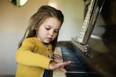 Adorable Cute Girl Playing Piano Concept Kids In The City