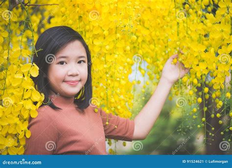 asian girl with golden shower tree i stock image image of camera fashion 91524621