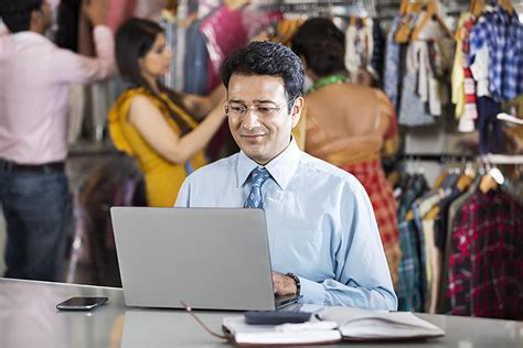 Indian Business Man Manager Using Laptop Working Boutique Shop