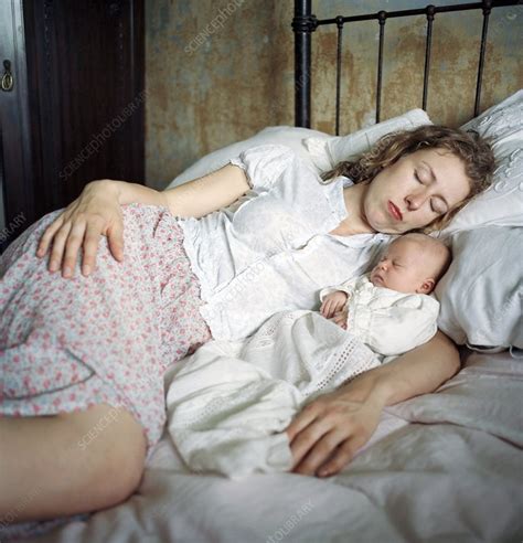 Mother Sleeping With Her Baby Stock Image C001 1085 Science Photo