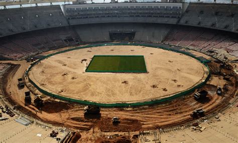 Editing by biden rushes to address global computer chip shortage via latest executive order. World's biggest cricket stadium takes shape in India ...