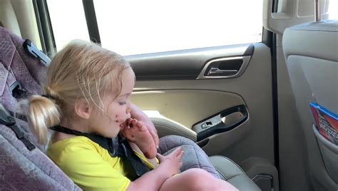 Little Girl Uses Her Foot To Take Out Chocolate From Door Console Of