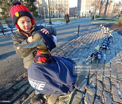 Tommy Joy Of Boston Enjoys The Make Way For Ducklings Statues In The News Photo Getty Images