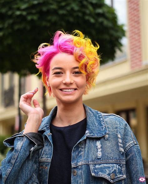 This Neon Pink To Yellow Ombre Pixie With Messy Curls Is A Great Modern Cut For Someone Seeking