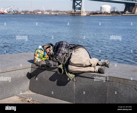 Homeless Man Sleeping On Bench Hi Res Stock Photography And Images Alamy