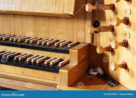 Part Of A Pipe Organ Console With Two Keyboards Or Manuals And Wooden
