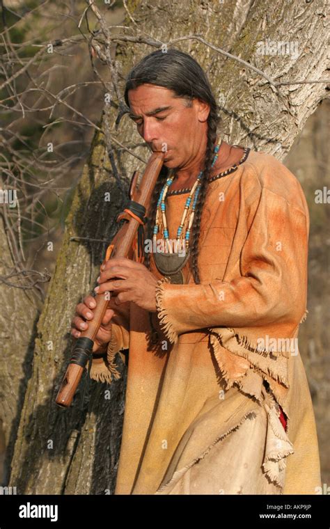 A Native American Indian Man Playing A Musical Flute Stock Photo Alamy