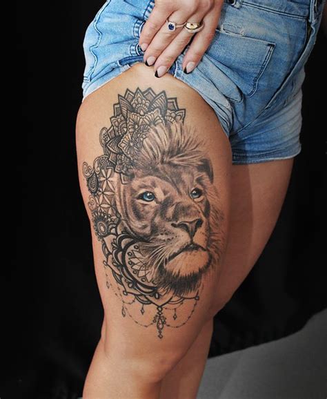 Line art tattoos are any tattoos composed predominately of distinct lines without shading on a blank background. Lion with blue eyes on womans leg. Artist Janis Andersons ...