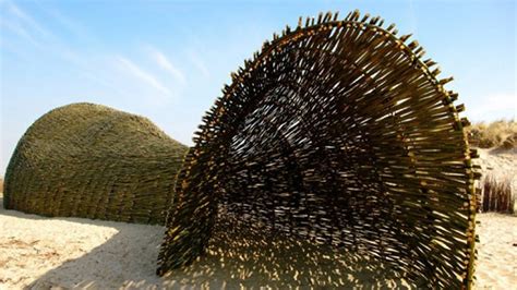 Artist creates 148-foot sandworm on the beach