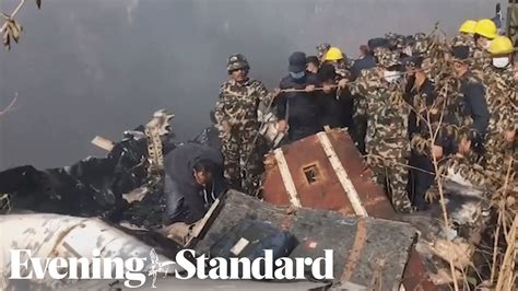 Nepal Plane Crash Rescuers Search Through Wreckage Youtube