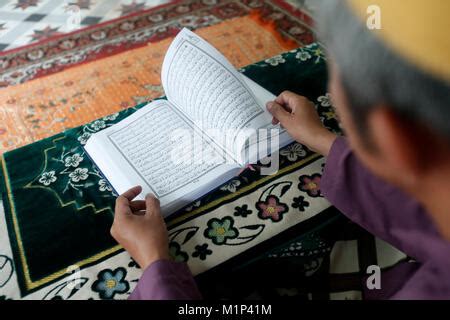 Saigon Central Mosque Muslim Man Reading An Arabic Holy Quran Or Koran
